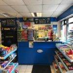 inside view of shop front with aisles of snacks