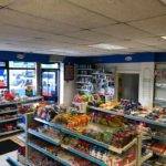 inside view of shop front with aisles of snacks